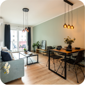 Salon z balkonem w mieszkania przy ulicy Wichrowej zaaranżowany przez pośrednika nieruchomości DOMiTY.